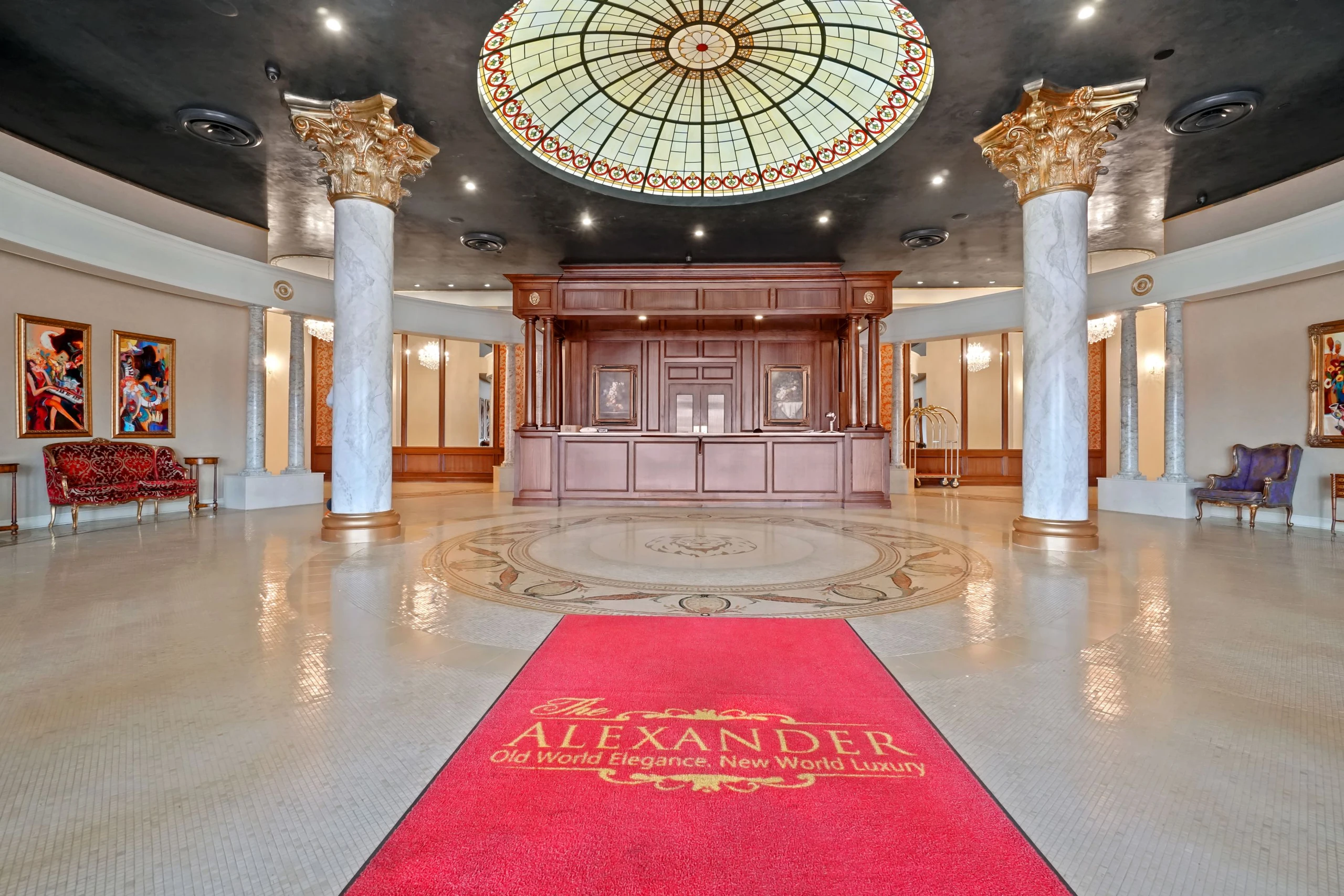 The Alexander lobby with marble floors, columns and stained-glass dome